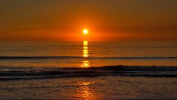 Beach sunset over clean ocean horizon I